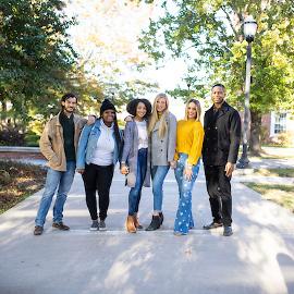 A group of students posting for the camera in Centennial Plaza. 