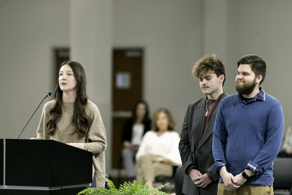 students at board of trustees meeting