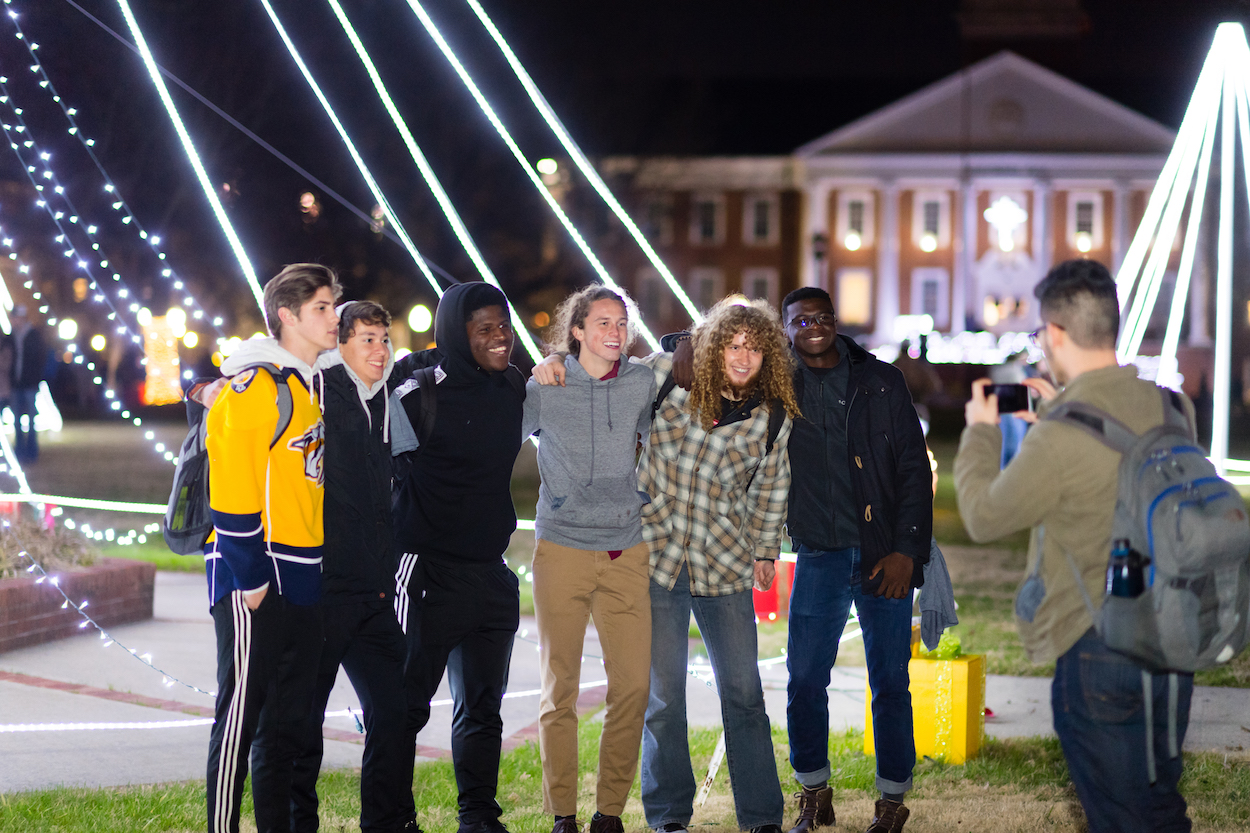 More than a thousand students drank hot chocolate, sang Christmas carols and got a free T-shirt to celebrate the third annual "Lighting the Quad" event on Tuesday night.