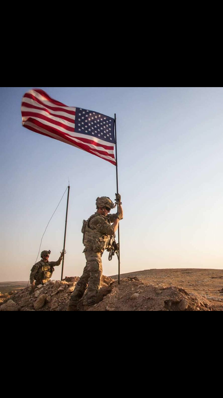 Tennessee Tech fresham Travis Williams plants a flag during a tour of duty in Syria as member of the United States Army.
