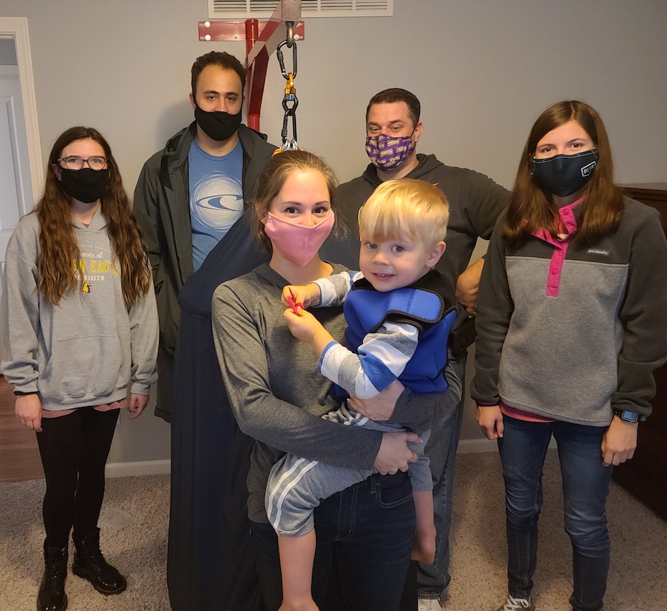 Tennessee Tech mechanical engineering students (back, from left) Lexie Carrier, Gabriel DaSilva, John Wagner and Emily Carroll created a sensory swing for Lorren Robertson's son, Aiden.