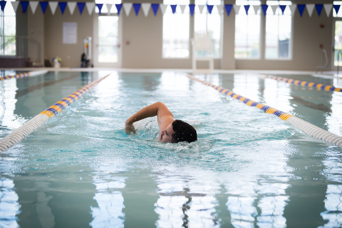 Tennessee Tech student Harmon Wattenbarger swims a lap in the aquatic center in the new Marc L. Burnett Fitness and Recreation Center. 