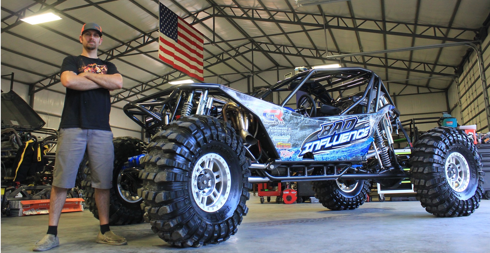 Tech alumnus Jake Burkey is pictured with one of the “rock bouncer” off road vehicles manufactured at Busted Knuckle Off Road. 