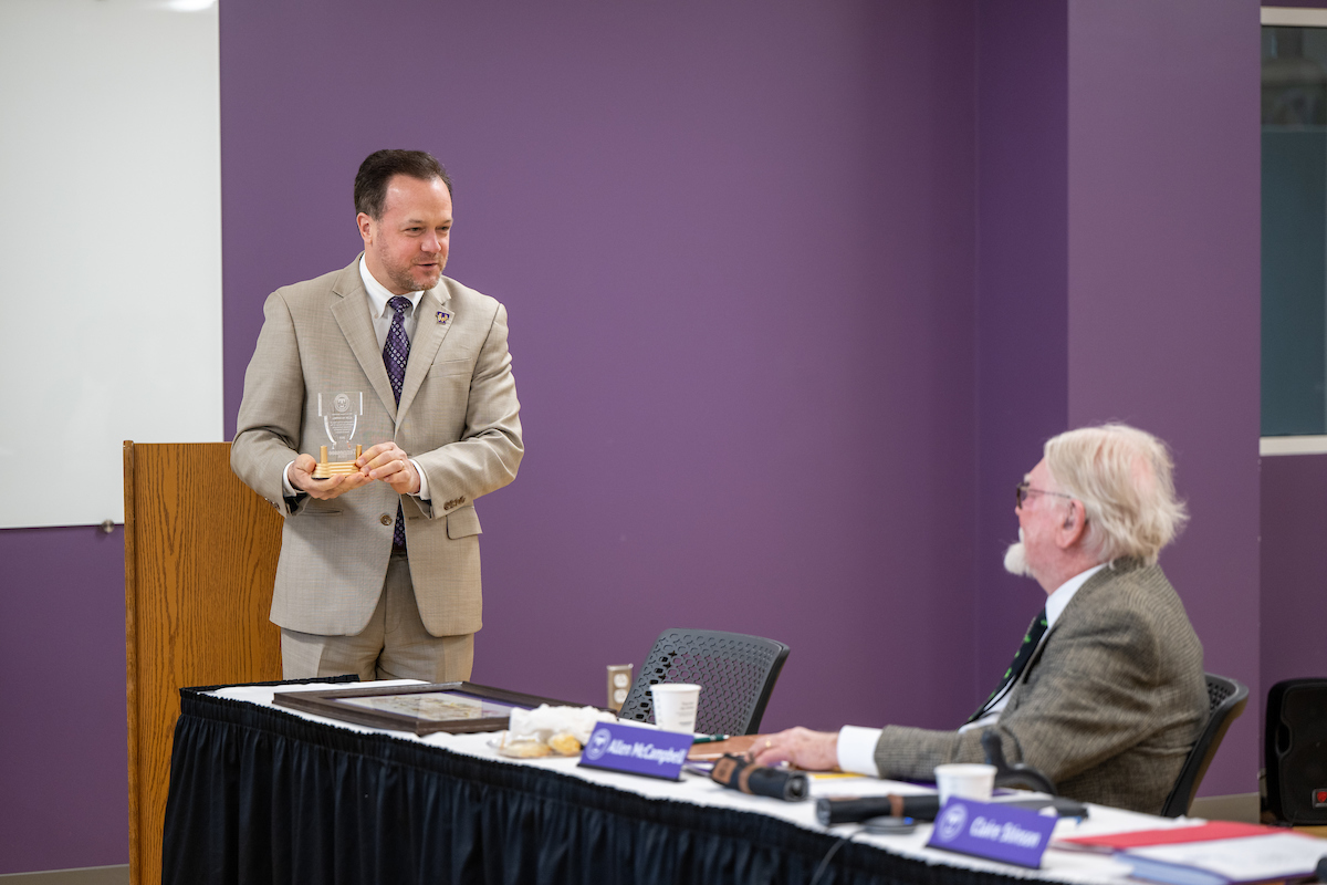 Tech Vice President for University Advancement Kevin Braswell pays tribute to Allen McCampbell in remarks at the Nov. 3 foundation board meeting while McCampbell looks on. 