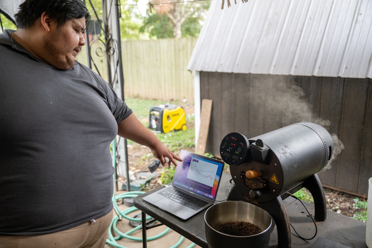 Miguel monitors the temperature of the beans in his small batch roaster. 