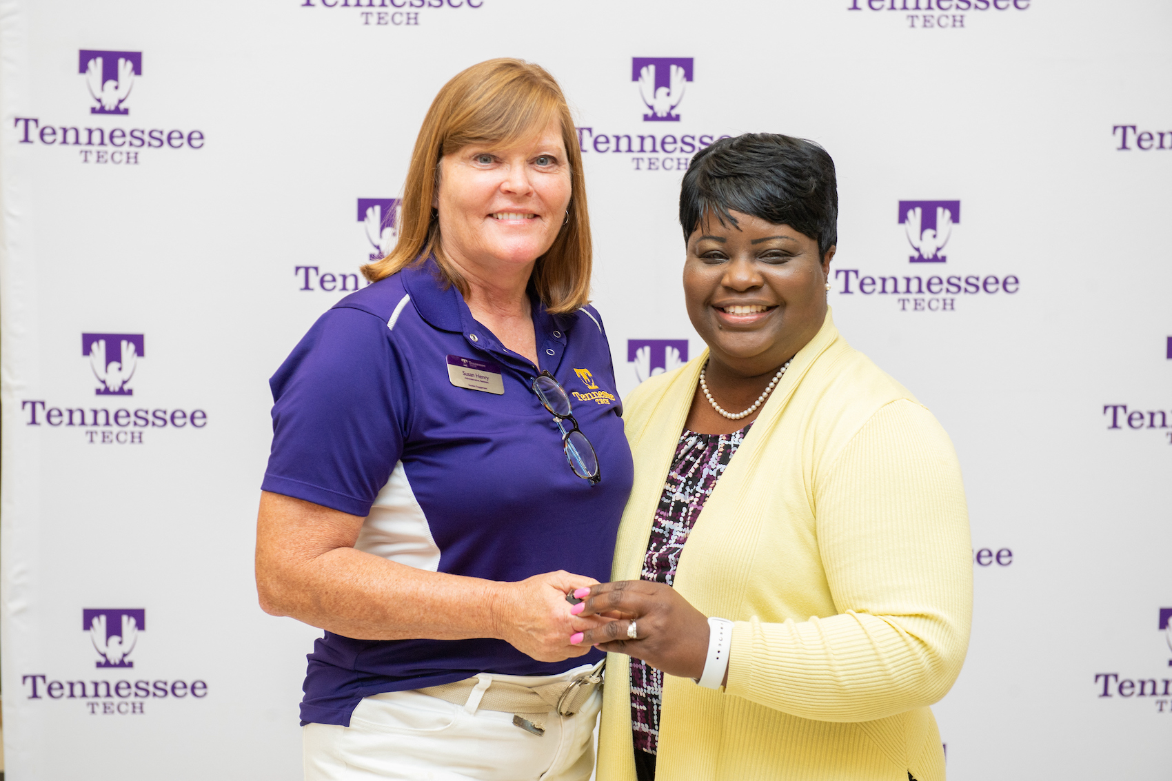 From left: Tech Vice President for Student Affairs Cynthia Polk-Johnson presents Susan Henry with her pin for 35 years of service to the university. 