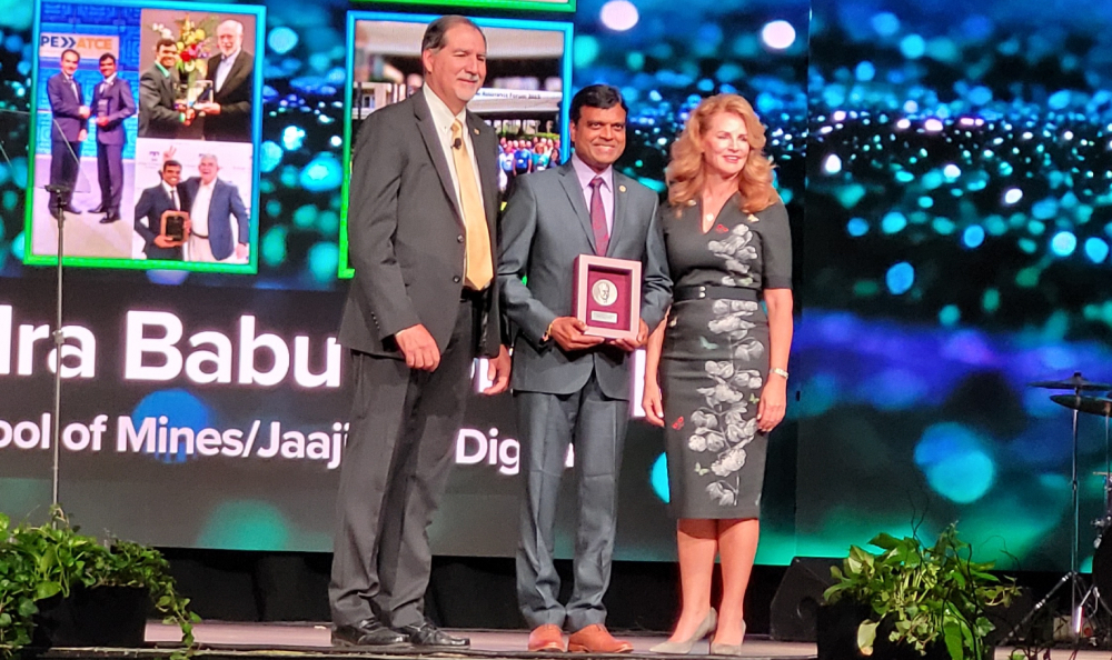 Tennessee Tech University alumnus Phaneendra Babu Kondapi, Ph.D., center, accepts the DeGolyer Distinguished Service Medal from Terry Palisch, left, Society of Petroleum Engineers president, and Shauna Noonan, American Institute of Mining, Metallurgical and Petroleum Engineers president-elect.