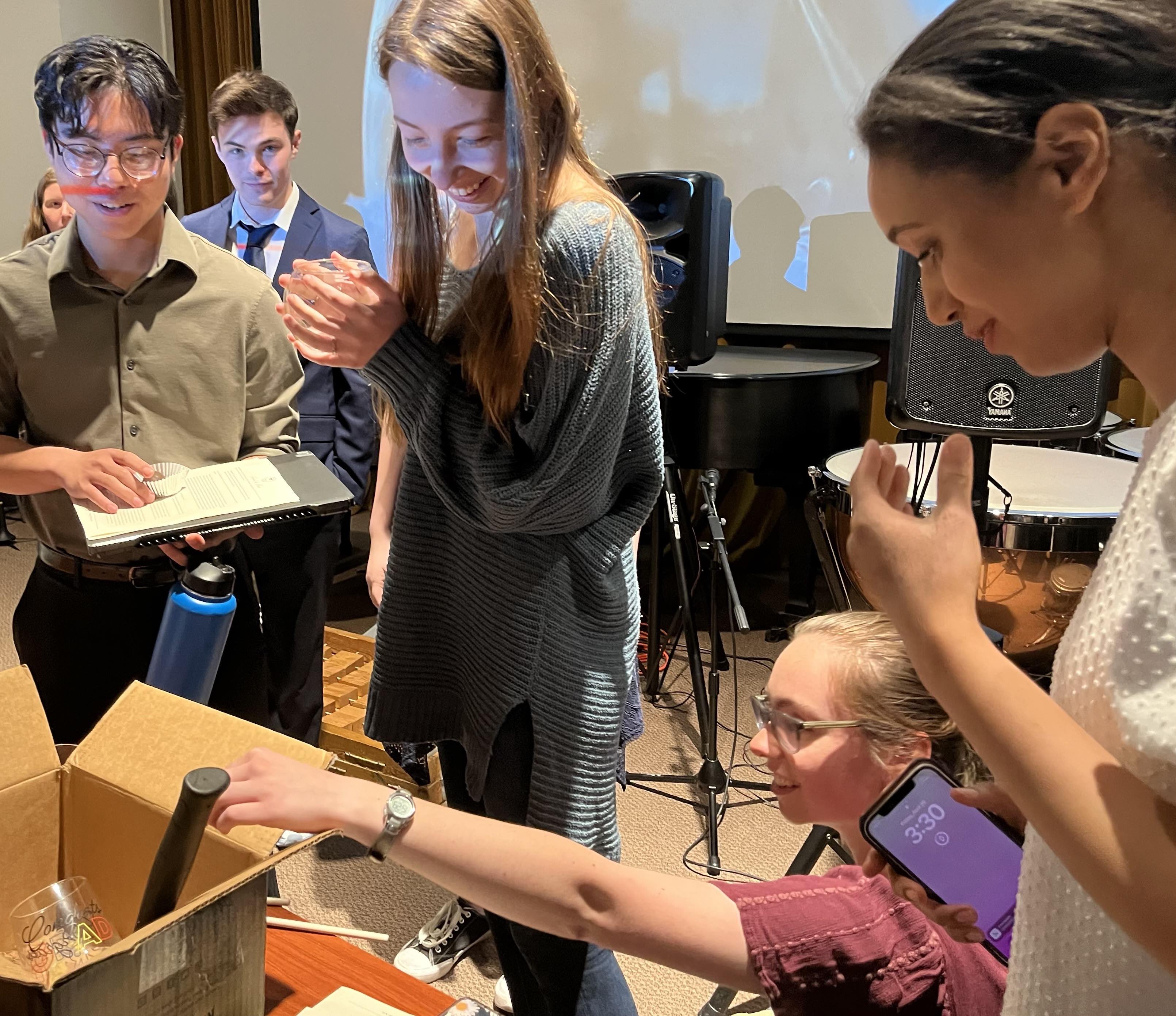 Students in the honors colloquium prepare for classmate Emily Ellsworth’s (center) musical number on the destruction of the coral reef. From left: Jeremy Eduave, Jacob Reed, Emily Ellsworth, Sarah Owens and Faith Jolley. 