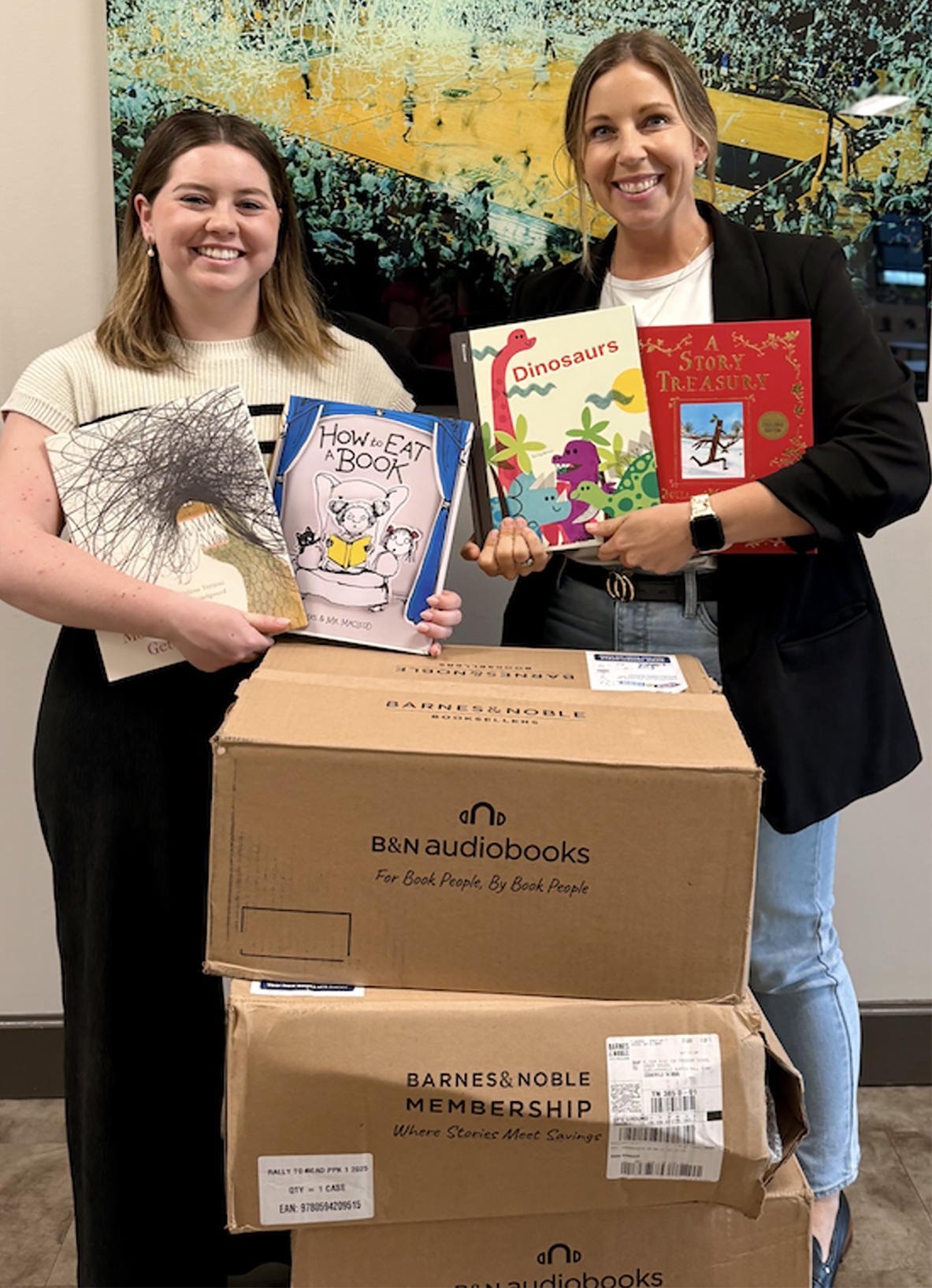From left: Cassie Brown, project director for Tennessee Tech’s Elinor Ross Freedom School, and Amber Spears, executive director, with boxes of new books from Reading Is Fundamental’s “Rally to Read 100” sweepstakes.