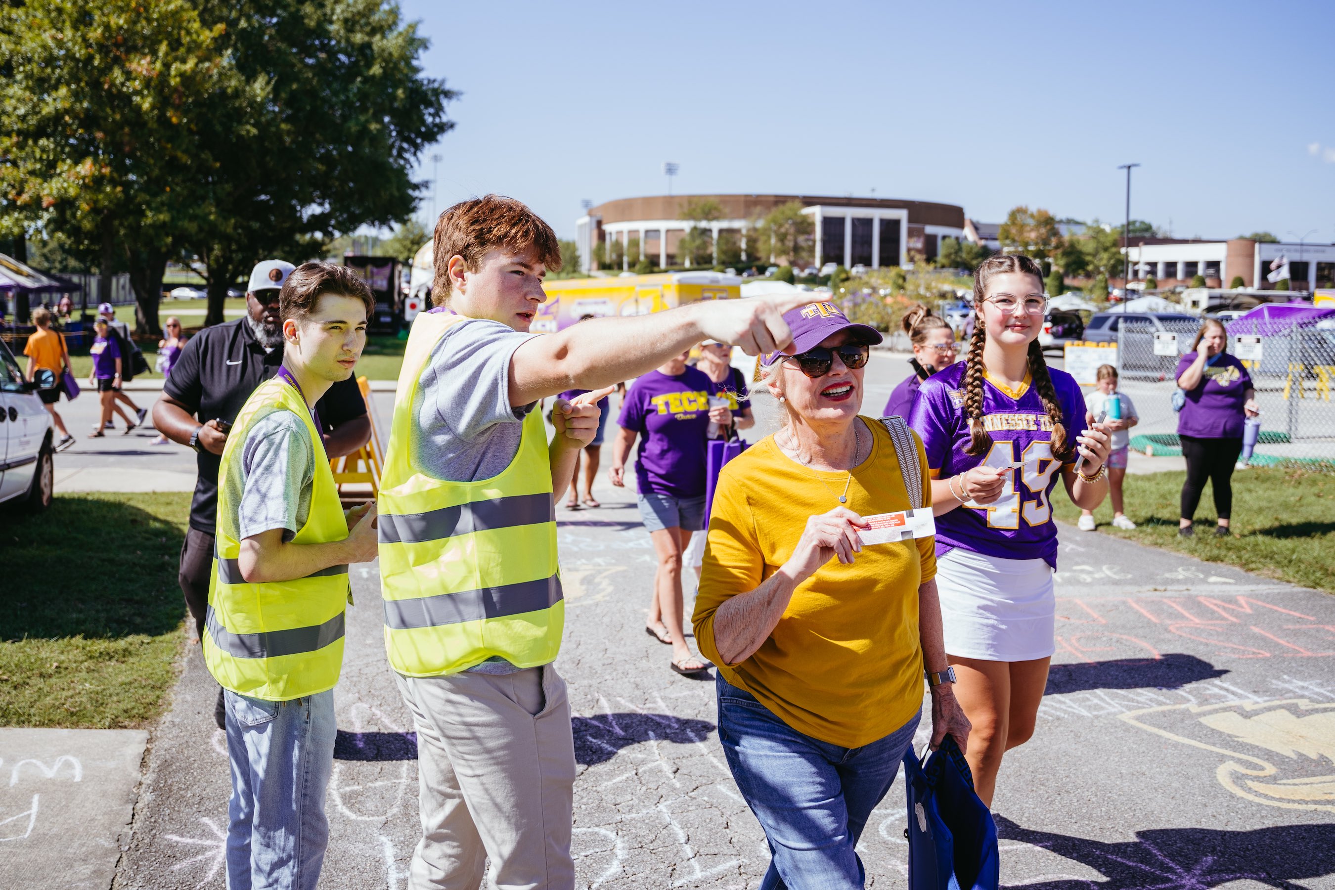Students Charles Jones (left) and Will Halfacre (second from left) help guide Golden Eagle fans into Tucker Stadium at a home football game.  Students Charles Jones (left) and Will Halfacre (second from left) help guide Golden Eagle fans into Tucker Stadium at a home football game.