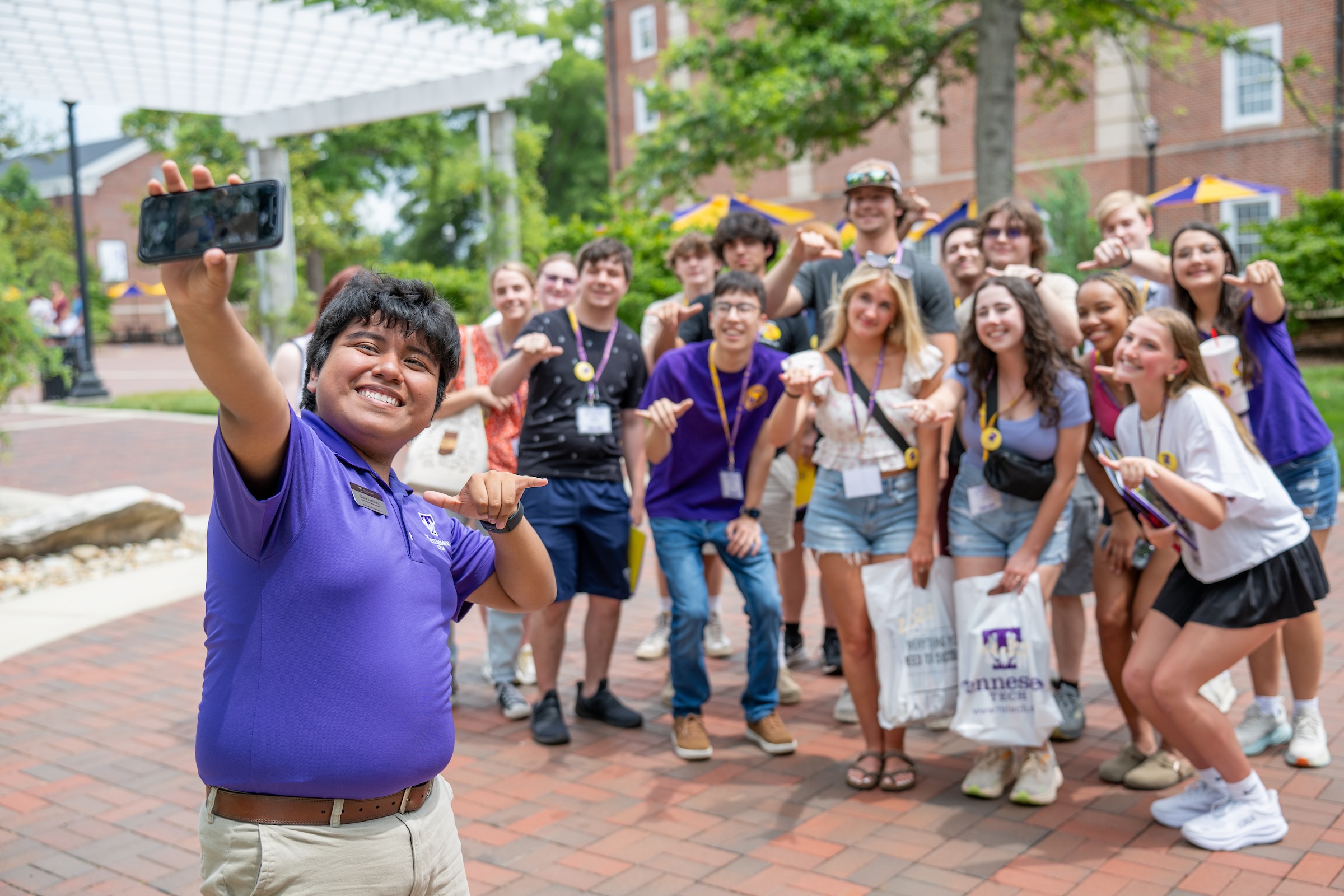 Tennessee Tech Student Orientation Assistant Gabriel Ramos takes a selfie with a group of incoming freshman students at a Student Orientation, Advisement and Registration (SOAR) session over the summer. 