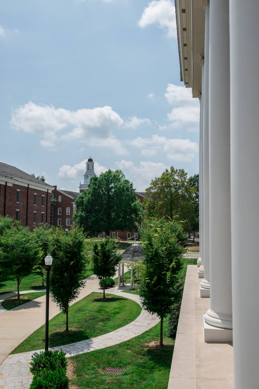 Photo of a walking path beside two residence halls.