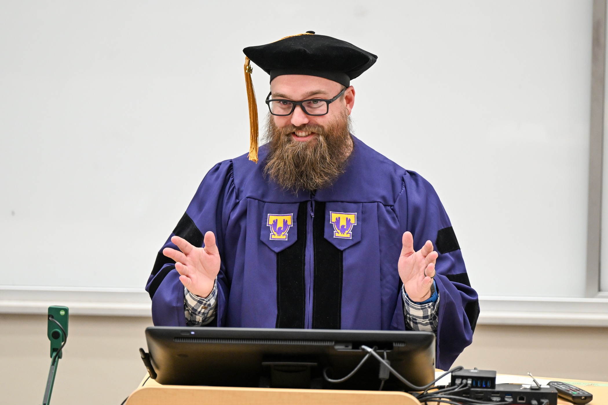Mason Hale in his doctoral graduation cap and gown.