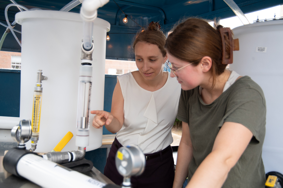 Laura Chavez and Catherine Murphy check their equipment.