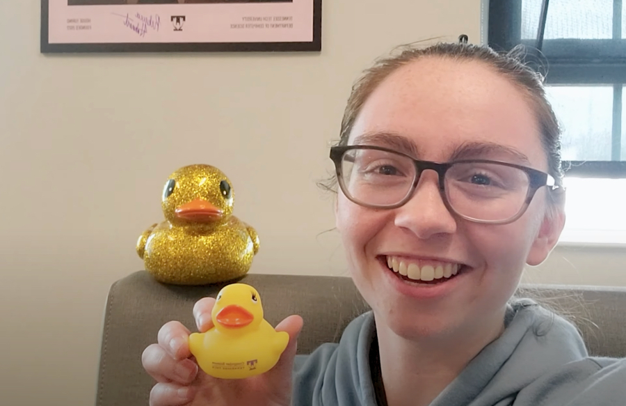Sara Owens holding a rubber duck with the TN Tech T logo.