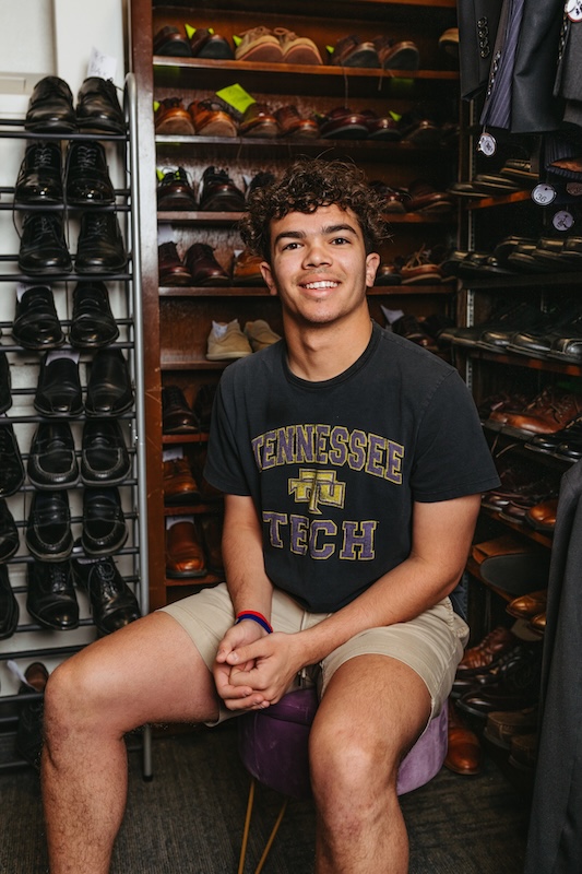 A student sits for a portrait in the PRL professional clothes closet at Tennessee Tech.