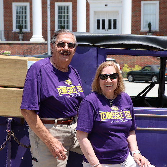 Larry and Jackie Ramsey pose with the Pep Truck