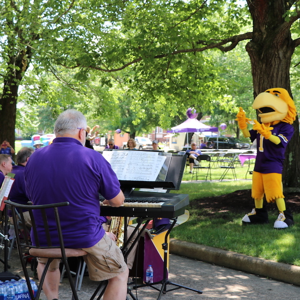 Awesome tries his hand at conducting the Troubadours. 