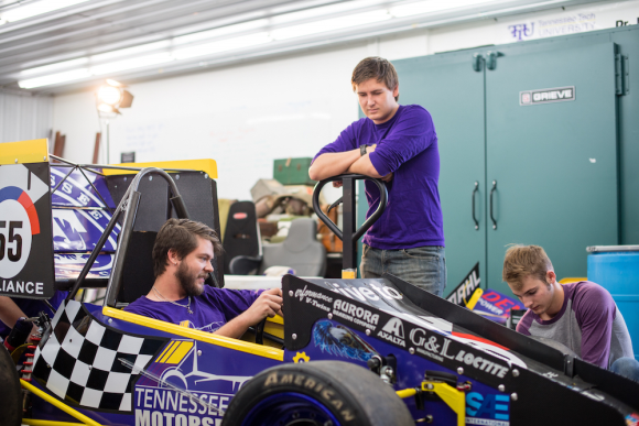 Baja vehicle and students