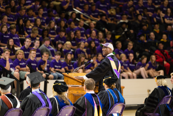 2019 Convocation - Marc Burnett is speaking to a group of Freshmen.