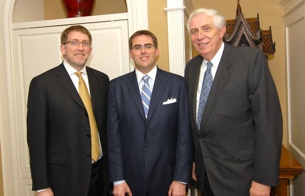 Steve Bivens standing with two colleagues.