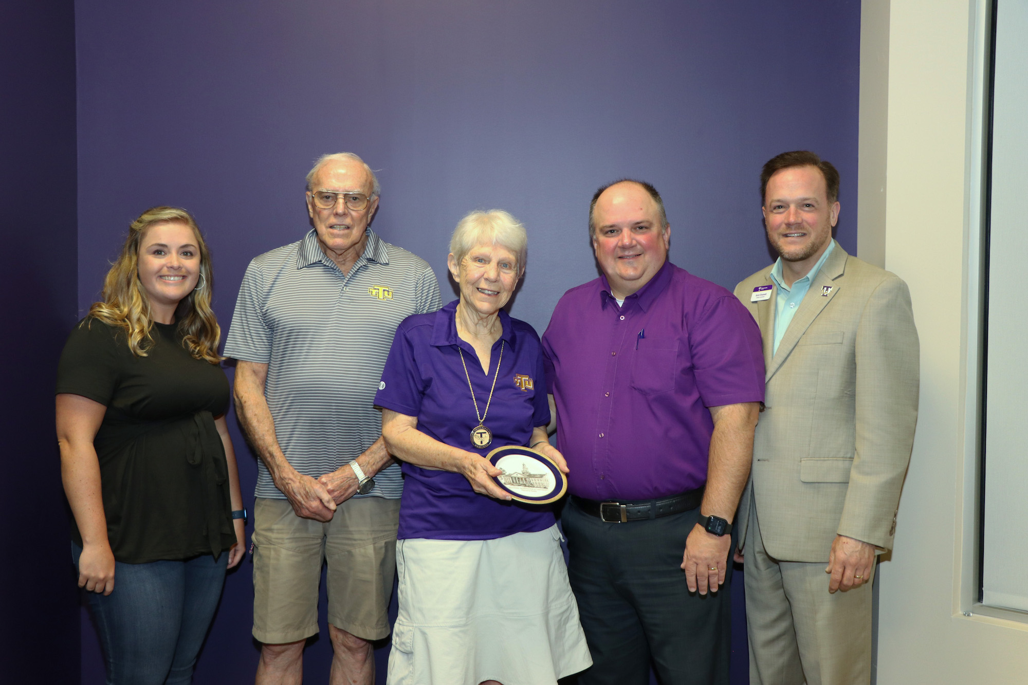 Jo and Gene Palmer smile with memebers of University Advancement staff, Amber Green, Tiff Rector, and Kevin Braswell