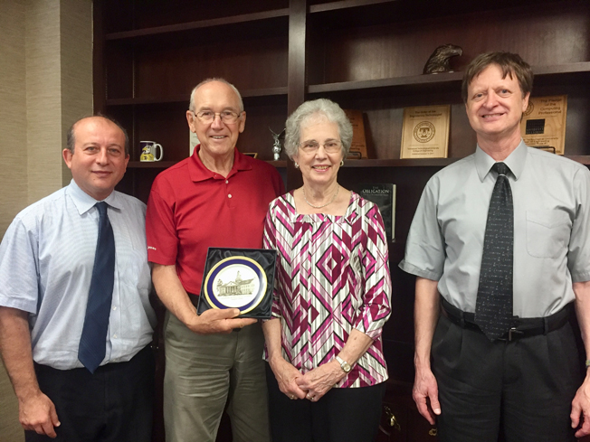 Norm and Carol Adams with faculty members