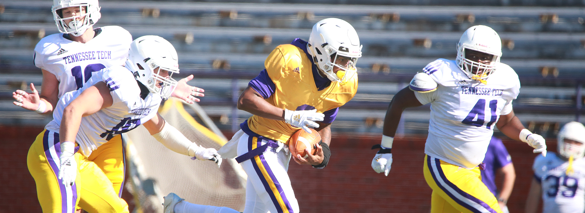 An image of Tech football players on the field