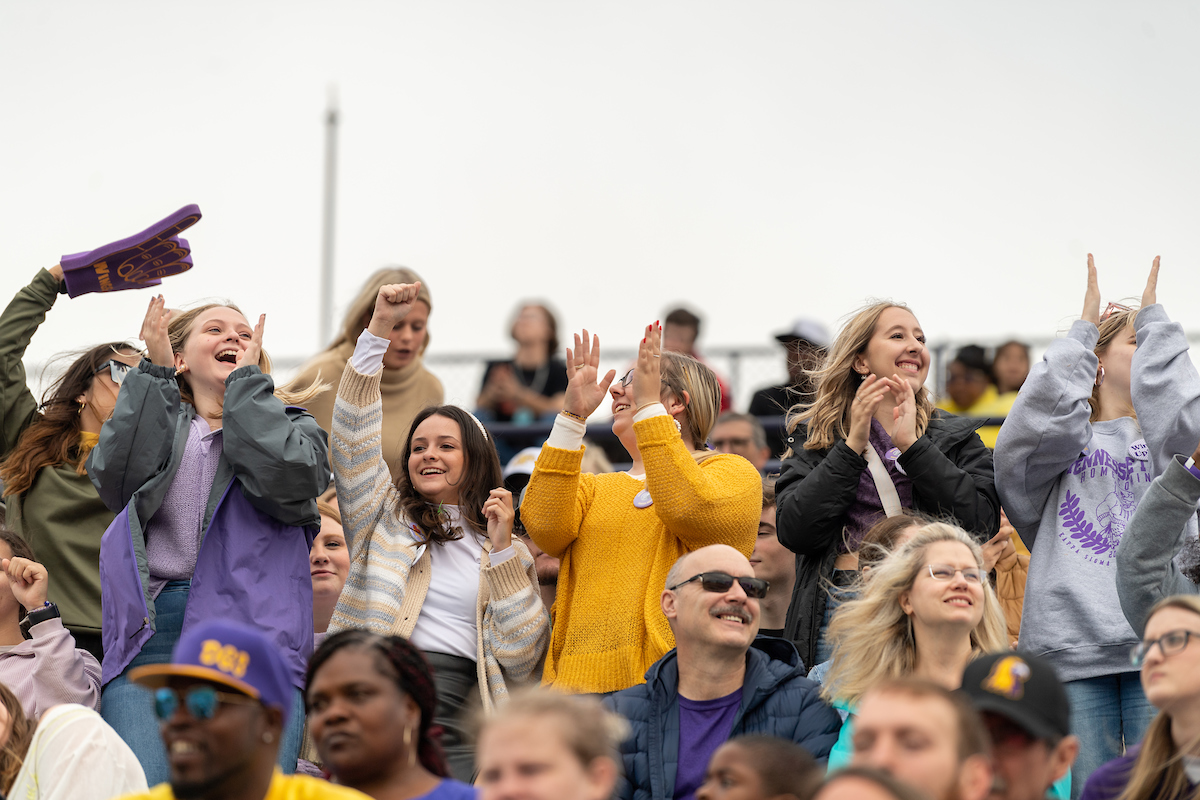 A group of students in the stands of Tucker Stadium