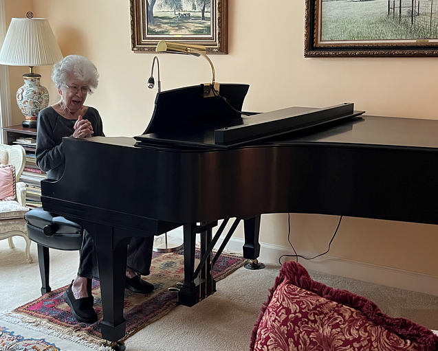 Ms. Spicer sits at the bench to play her piano one last time before giving it to Tennessee Tech