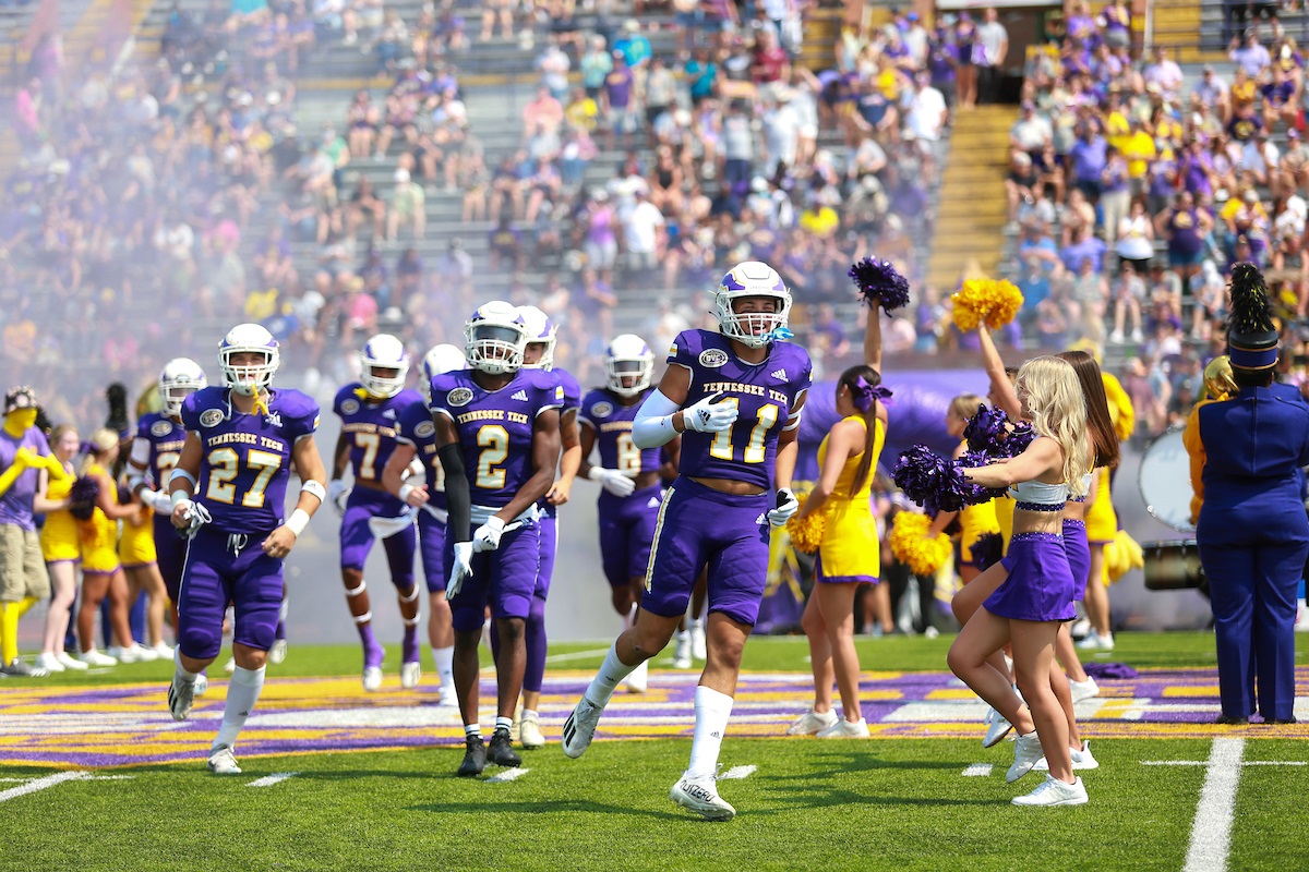 The Golden Eagle football and cheer team on Overall Field