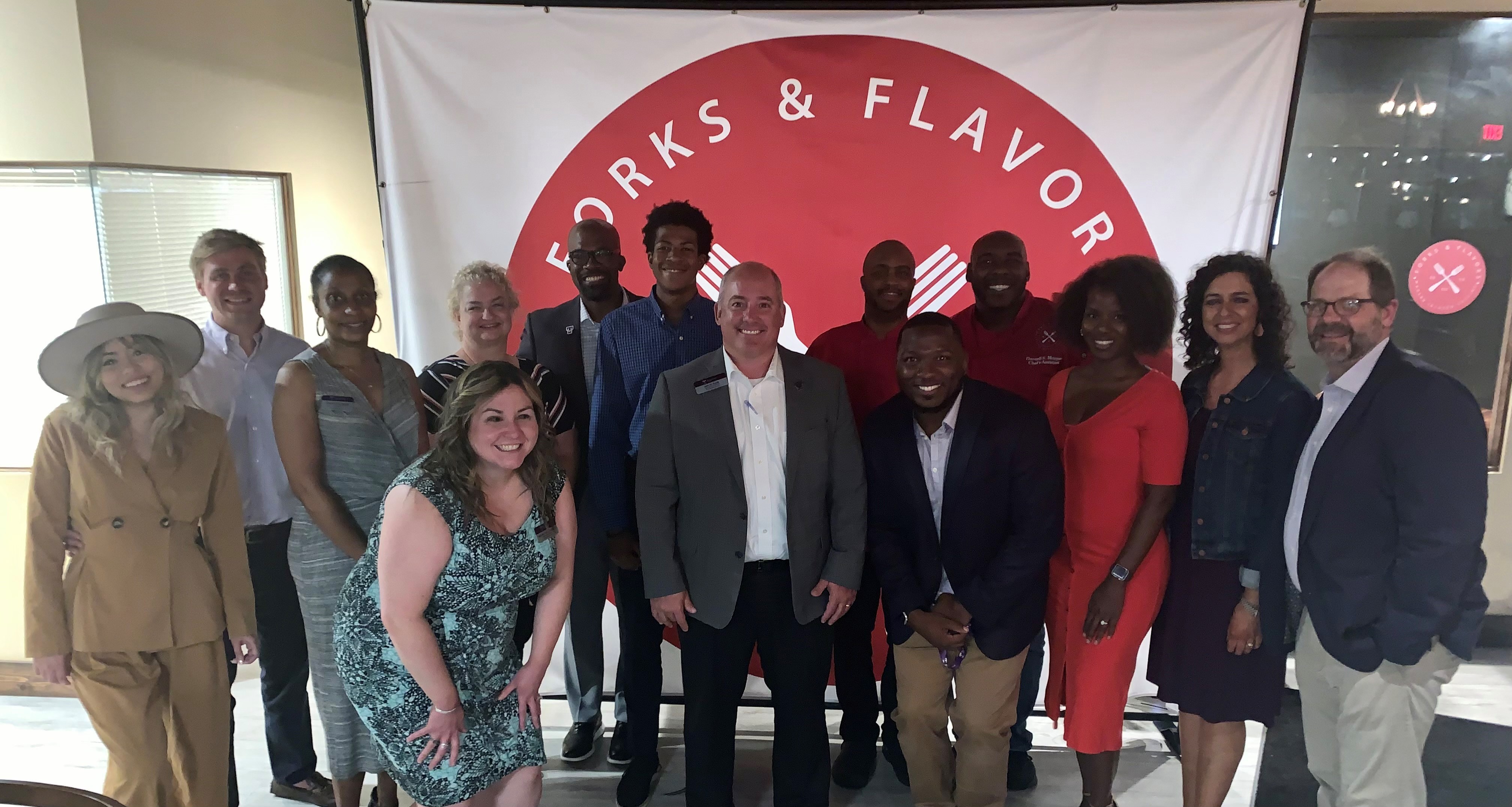 A group photo of the Kennesaw dinner attendees.