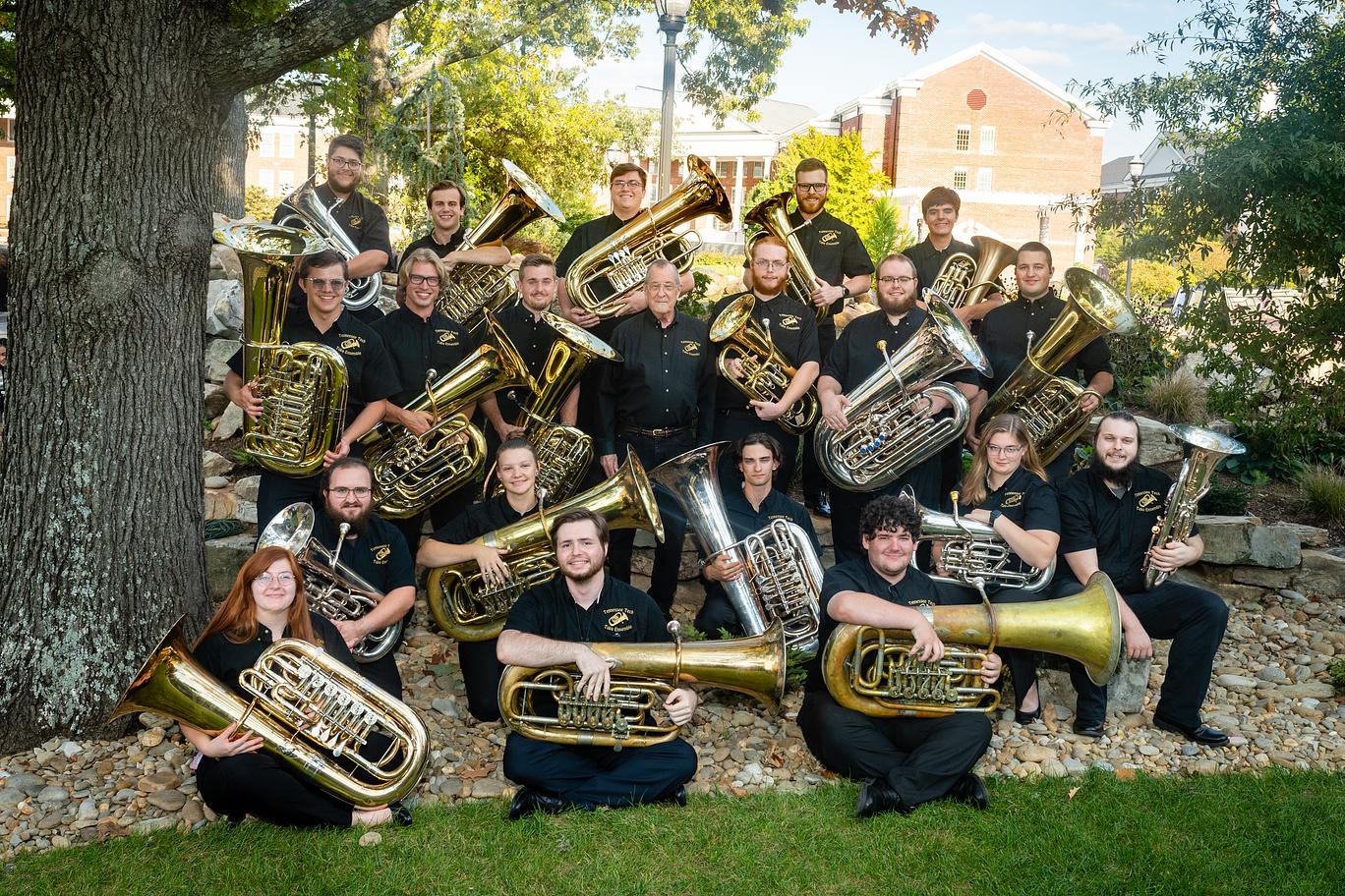 The Tennessee Tech Tuba Ensemble poses with Winston Morris