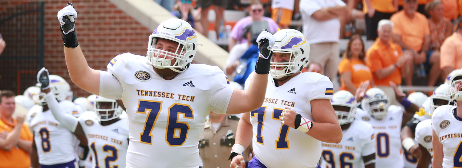 Football players in Tech jerseys and helmets