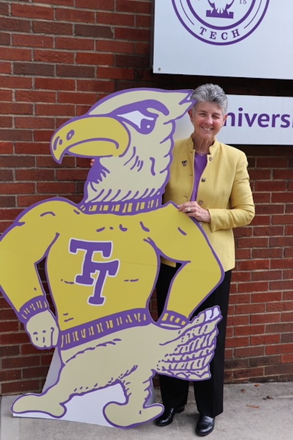 Dianne Murphy behind a large cutout of Tommy Tech