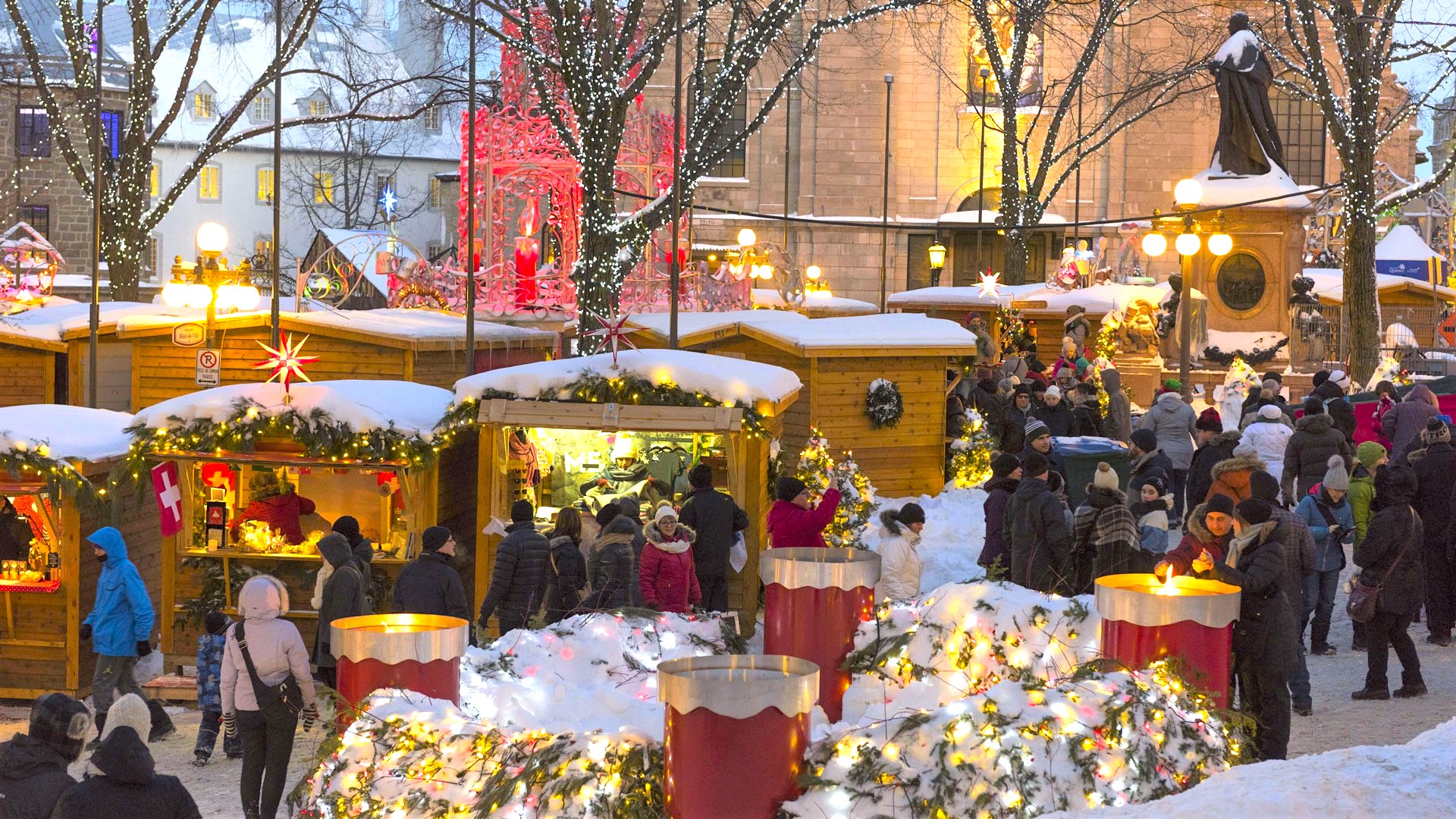 A Christmas market lit up with holiday lights.