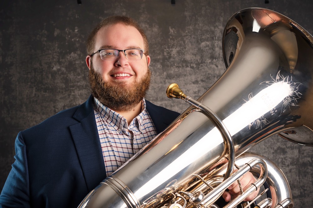 Preston Light poses with a tuba