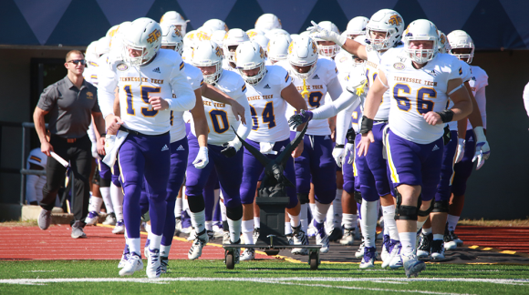 TTU football team running onto the field