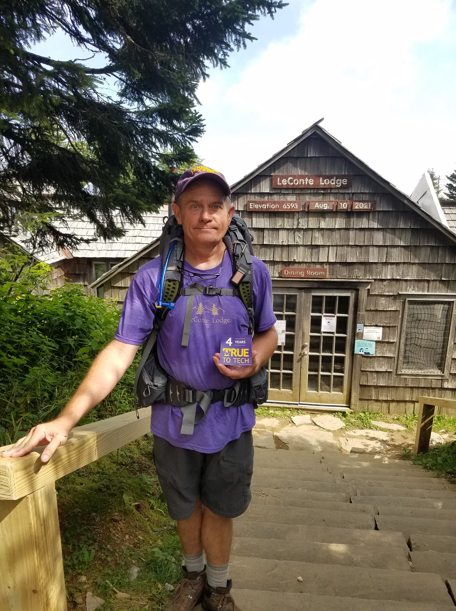 Billy Lewis stands with his 4 years True To Tech magnet in front of LeConte Lodge.