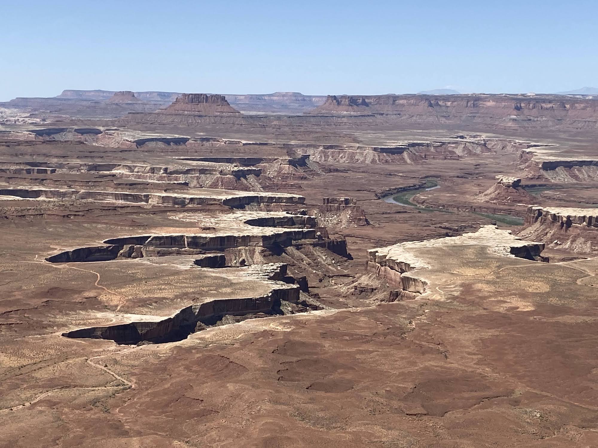 deep canyons cut in brown layered rock