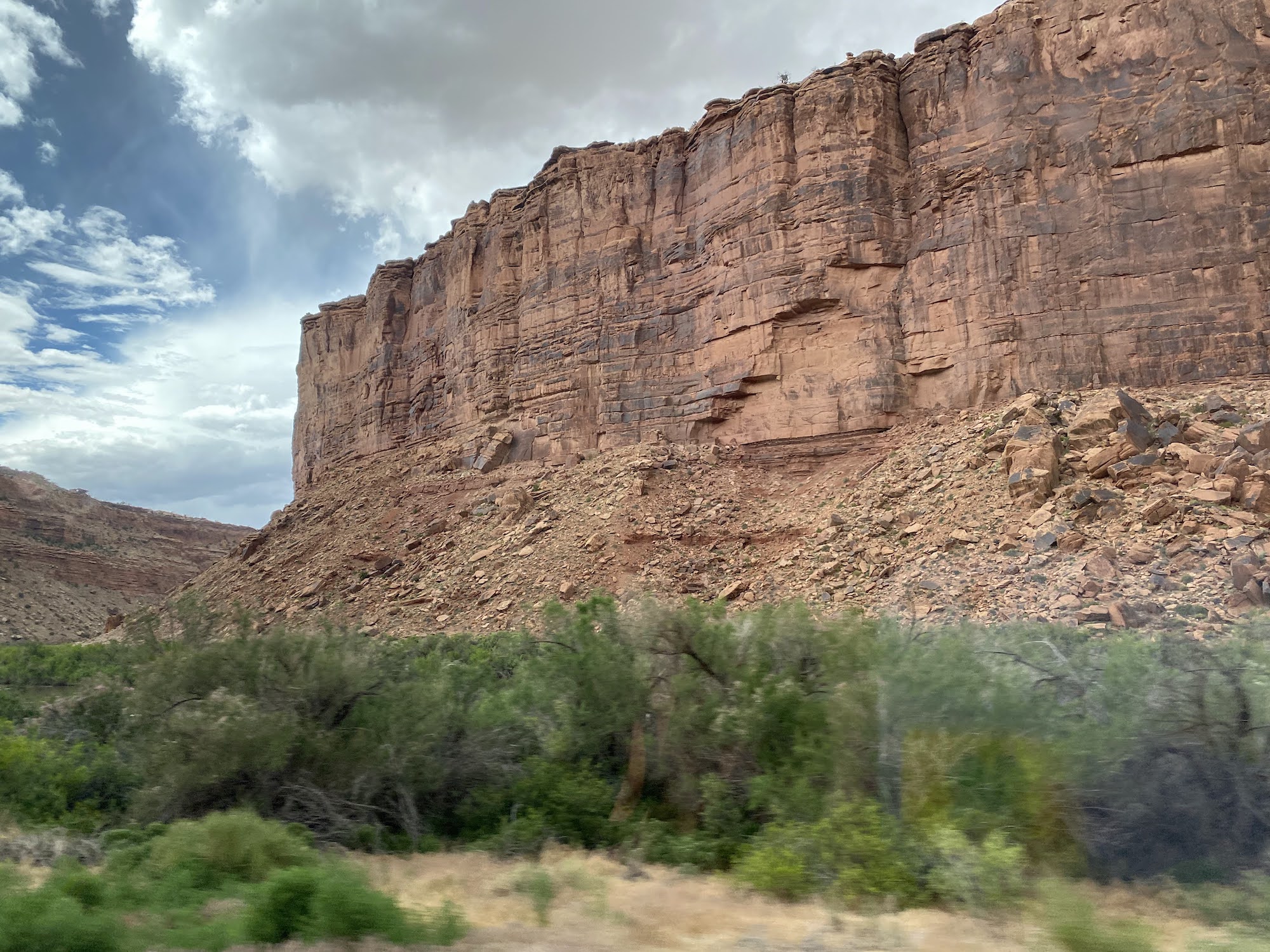 yellow sandstone with cloudy sky above